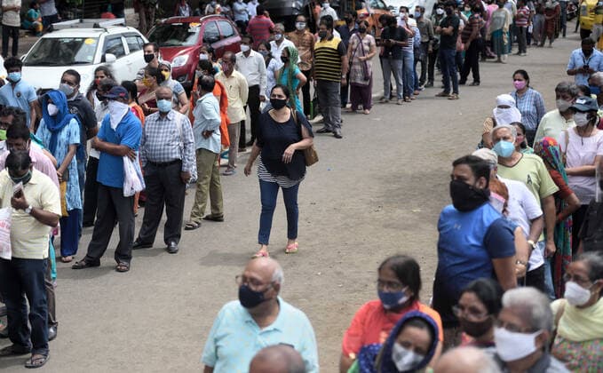 MUMBAI, INDIA - APRIl 23: People lined up to receive a dose of COVID-19 vaccine at Dahisar Vaccination Centre, on April 23, 2021 in Mumbai, India. (Photo by Satish Bate Hindustan Times) 4th Phase Of Covid-19 Vaccination