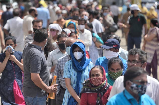 MUMBAI, INDIA - APRIl 23: People lined up to receive a dose of COVID-19 vaccine at Dahisar Vaccination Centre, on April 23, 2021 in Mumbai, India. (Photo by Satish Bate Hindustan Times) 4th Phase Of Covid-19 Vaccination
