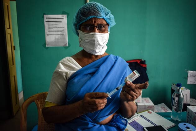 Vaccine crisis in Kolkata A Health worker prepares a dose of Covaxin (Vaccine of Corona Virus) inside on a West Bengal state Health Vaccination centre in Kolkata. Kolkata West Bengal India Copyright: SudiptaxDas