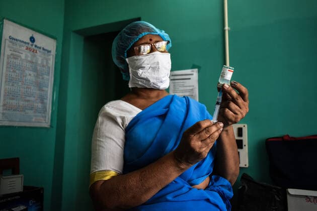 Vaccine crisis in Kolkata A Health worker prepares a dose of Covaxin (Vaccine of Corona Virus) inside on a West Bengal state Health Vaccination centre in Kolkata. Kolkata West Bengal India Copyright: SudiptaxDas