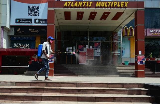 April 24, 2021, Prayagraj, Uttar Pradesh, India: Prayagraj: A worker disinfecting a mall during a weekend lockdown imposed by the government as a preventive measure against the Covid-19 coronavirus, in Prayagraj on Saturday, April 24, 2021. Prayagraj India - ZUMAv115 20210424_zap_v115_009 Copyright: xPrabhatxKumarxVermax