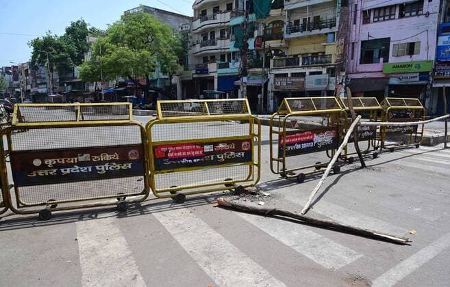 April 24, 2021, Prayagraj, Uttar Pradesh, India: Prayagraj: Police barricade road during a weekend lockdown imposed by the government as a preventive measure against the Covid-19 coronavirus, in Prayagraj on Saturday, April 24, 2021. Prayagraj India - ZUMAv115 20210424_zap_v115_012 Copyright: xPrabhatxKumarxVermax