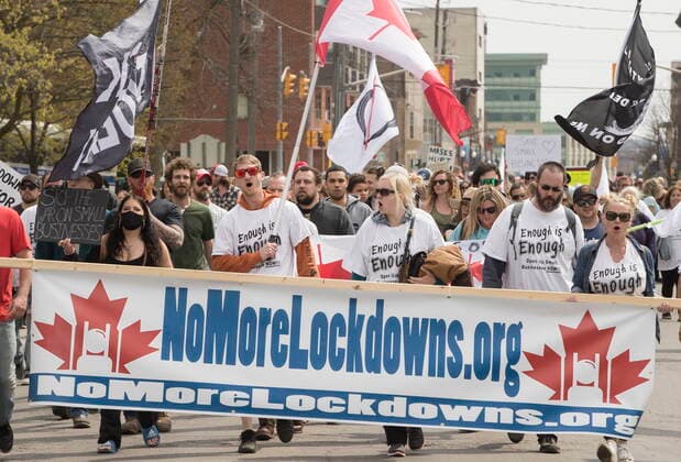 April 24, 2021, Peterborough, on, Canada: Demonstrators march at a protest against government measures to curb the spread of COVID-19, in Peterborough, Ont., Saturday, April 24, 2021. Peterborough Canada  - ZUMAc35_ 20210424_zaf_c35_025 Copyright: xFredxThornhillx