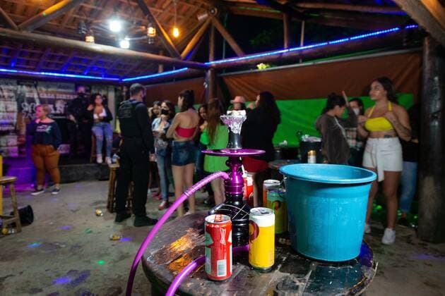April 25, 2021, Sao Paulo, Sao Paulo, Brazil: Police officers dispersed an illegal and clandestine party in Carapicuiba (Sao Paulo) in the early hours of Sunday, 25. About 120 people were in place, most without a face shield, drinking and smoking hookah, disregarding the health conditions and failing to comply with the quarantine against Covid-19. Sao Paulo Brazil - ZUMAl146 20210425_zaf_l146_001 Copyright: xPauloxLopesx