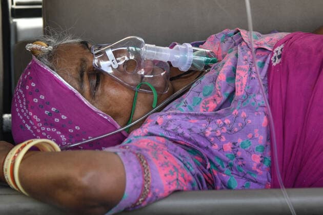 Coronavirus patient in an ambulance Coronavirus patient waiting in an ambulance to be admitted in Jawaharlal Nehru Hospital. Ajmer Rajasthan India Copyright: ShaukatxAhmed