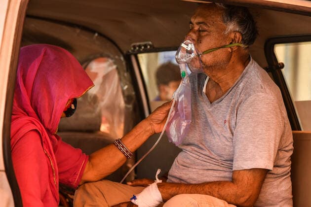 Coronavirus patient in an ambulance Coronavirus patient waiting in an ambulance to be admitted in Jawaharlal Nehru Hospital. Ajmer Rajasthan India Copyright: ShaukatxAhmed