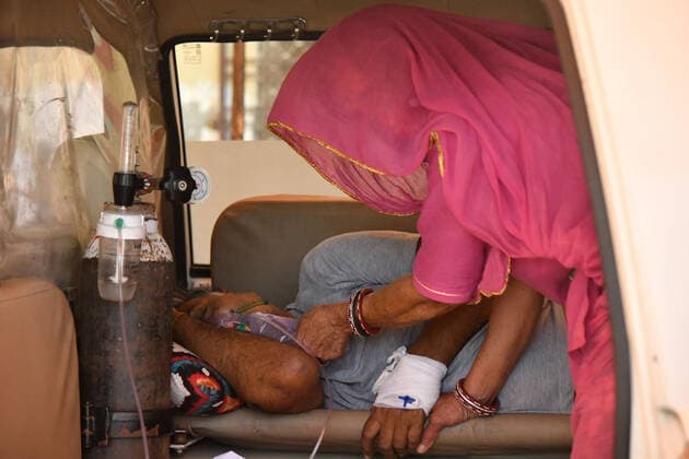 Coronavirus patient in an ambulance Coronavirus patient waiting in an ambulance to be admitted in Jawaharlal Nehru Hospital. Ajmer Rajasthan India Copyright: ShaukatxAhmed