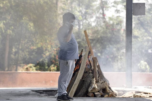 NOIDA, INDIA APRIL 25: A funeral pyre of a Covid-19 victim, at a crematorium, in Sector 94, on April 25, 2021 in Noida, India. (Photo by Sunil Ghosh Hindustan Times ) Covid Death Toll Continues To Rise In India