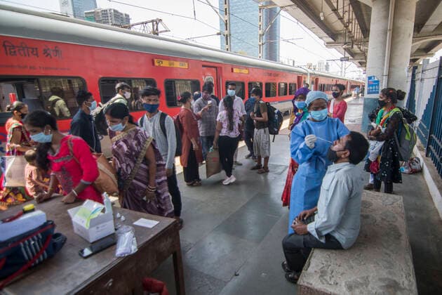 MUMBAI, INDIA APRIL 25: Healthcare worker collects swab sample of the passengers at Dadar station, on April 25, 2021 in Mumbai, India. (Photo by Pratik Chorge Hindustan Times ) Daily Life Amid Coronavirus Pandemic In India