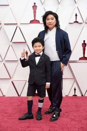 OscarÂ® nominees Alan Kim and Christina Oh arrives on the red carpet of The 93rd OscarsÂ® at Union Station in Los Angeles, CA on Sunday, April 25, 2021. Los Angeles CA USA  Copyright: xMattxPetitx 34135161THA