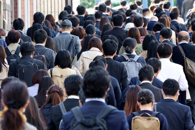 April 26, 2021, Tokyo, Japan - People walk to their offices amid outbreak of the new coronavirus in Tokyo on Monday, April 26, 2021. Tokyo, Osaka, Kyoto and Hyogo prefecture entered a new state of emergency for COVID-19 on April 25 through May 11.  (159071259)