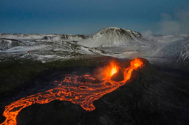 Creative Highlights World Volcano erupting with hot orange lava Grindavik, Iceland CR_OSBJ210426-727838-01