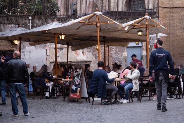Italy: Restaurants open for dinner in Rome People dine outdoors at a restaurant in Trastevere district in Rome on April 26, 2021 Rome Italy Copyright: MatteoxNardone