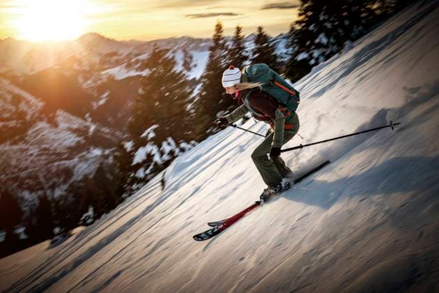 Mid adult woman skiing on snowy mountain during winter model released Symbolfoto MALF00343