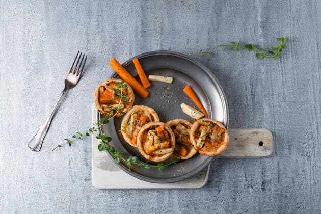 Pie with carrots and parsnip on tin plate MYF02121