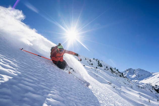 Sun shining over man skiing in Arlberg massif model released Symbolfoto RNF01303