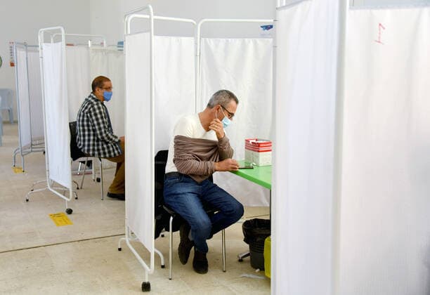 April 27, 2021, Tunis, Tunisia: People wait to receive a dose of the Pfizer-BioNTech COVID-19 vaccine at Ariana Youth Center as vaccination centers across the country experience an influx of registrations during Ramadan. Tunis Tunisia - ZUMAs197 20210427_zaa_s197_027 Copyright: xJdidixWassimx