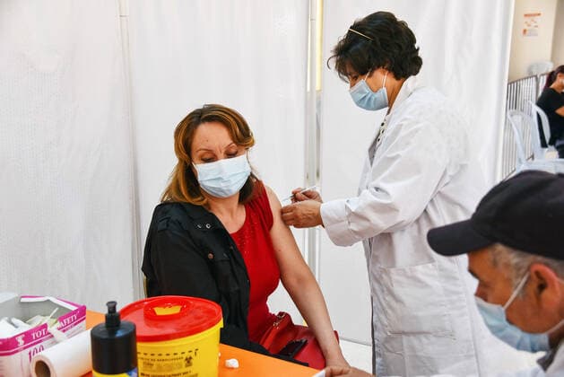 April 27, 2021, Tunis, Tunisia: A woman receives a dose of the Pfizer-BioNTech COVID-19 vaccine at Ariana Youth Center as vaccination centers across the country experience an influx of registrations during Ramadan. Tunis Tunisia - ZUMAs197 20210427_zaa_s197_029 Copyright: xJdidixWassimx