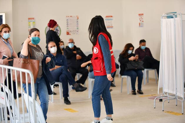 April 27, 2021, Tunis, Tunisia: People wait to receive a dose of the Pfizer-BioNTech COVID-19 vaccine at Ariana Youth Center as vaccination centers across the country experience an influx of registrations during Ramadan. Tunis Tunisia - ZUMAs197 20210427_zaa_s197_034 Copyright: xJdidixWassimx