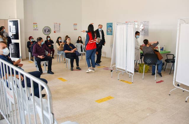 April 27, 2021, Tunis, Tunisia: People wait to receive a dose of the Pfizer-BioNTech COVID-19 vaccine at Ariana Youth Center as vaccination centers across the country experience an influx of registrations during Ramadan. Tunis Tunisia - ZUMAs197 20210427_zaa_s197_035 Copyright: xJdidixWassimx