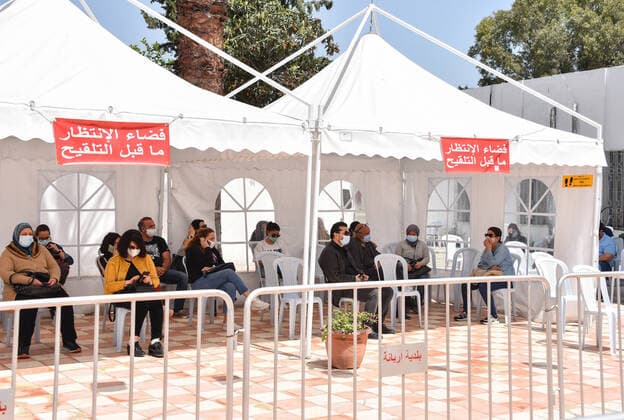 April 27, 2021, Tunis, Tunisia: People wait to receive a dose of the Pfizer-BioNTech COVID-19 vaccine at Ariana Youth Center as vaccination centers across the country experience an influx of registrations during Ramadan. Tunis Tunisia - ZUMAs197 20210427_zaa_s197_037 Copyright: xJdidixWassimx