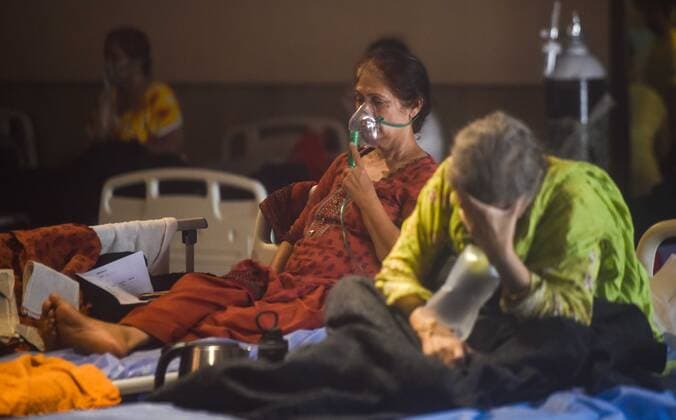 NEW DELHI, INDIA - APRIL 27: A view inside a temporary Covid Care Centre set up at Shehnai Banquet Hall attached to LNJP Hospital, on April 27, 2021 in New Delhi, India. As Covid-19 cases continued to surge in Delhi with over 98,264 active cases people are struggling to get hospital beds, ventilators, oxygen cylinders, injections and medicines with the health infrastructure in the state almost stretched to its limit. (Photo by Amal KS Hindustan Times) As COVID Cases Surge, Indian Hospitals Struggle With Shortage Of Beds