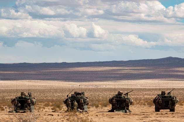 March 10, 2021 - Fort Irwin, California, United States - Washington Army National Guard Soldiers, assigned to 3rd Battalion, 161 Infantry Regiment Dark Rifles , 81st Stryker Brigade Combat Team, prepare their Stryker vehicles for an upcoming reconnaissance mission at the Logistics Support Area Forward Operating Base Santa Fe, Fort Irwin, California, on March 10th, 2021. The âDark Rifleâ Soldiers are conducting a month-long field training exercise in preparation for their deployment to Poland this Spring, in support of multinational force Enhanced Forward Presence. National Guard Sgt. Adeline Witherspoon Fort Irwin United States - ZUMAz03_ 20210310_sso_z03_476 Copyright: xU.S.xArmyx