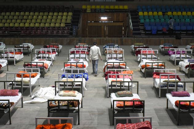 April 27, 2021: A worker inspects beds at a makeshift Covid-19 hospital cum containment in Srinagar, Indian Administered Kashmir on 27 April 2021. Authorities have turned Sher E Kashmir International Stadium into containment centre after the rise in Covid-19 cases in Jammu and kashmir. - ZUMAd99_ 20210427_zap_d99_039 Copyright: xMuzamilxMattoox