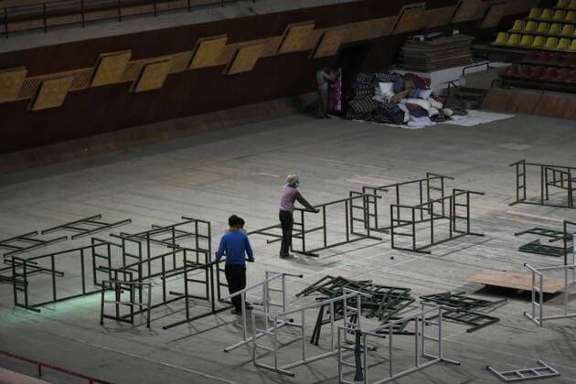 April 27, 2021: workers set up beds at a makeshift Covid-19 hospital cum containment in Srinagar, Indian Administered Kashmir on 27 April 2021. Authorities have turned Sher E Kashmir indoor Stadium into containment centre after the rise in Covid-19 cases in Jammu and kashmir. - ZUMAd99_ 20210427_zap_d99_055 Copyright: xMuzamilxMattoox