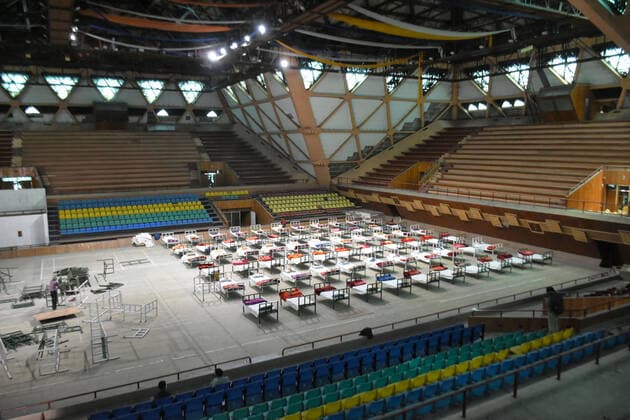 April 27, 2021: Beds being setup at a makeshift Covid-19 hospital cum containment in Srinagar, Indian Administered Kashmir on 27 April 2021. Authorities have turned Sher E Kashmir International Stadium into containment centre after the rise in Covid-19 cases in Jammu and kashmir. - ZUMAd99_ 20210427_zap_d99_061 Copyright: xMuzamilxMattoox