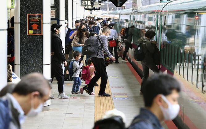 Golden Week holidays amid coronavirus pandemic People get on a Tohoku Shinkansen bullet train at Tokyo Station on April 29, 2021. Japan s Golden Week holiday period started the same day while the capital, along with Osaka area, remains in a coronavirus state of emergency. 