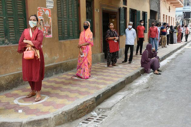 India: 8th Phase of Polling at West Bengal Voters are waiting with maintaining social distance and proper use of Face Mask before enter in Polling Booth at Kolkata. Kolkata India Copyright: SuraranjanxNandi