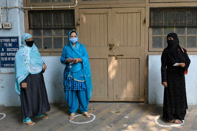 India: 8th Phase of Polling at West Bengal Voters are waiting with maintaining social distance and proper use of Face Mask before enter in Polling Booth at Kolkata. Kolkata India Copyright: SuraranjanxNandi