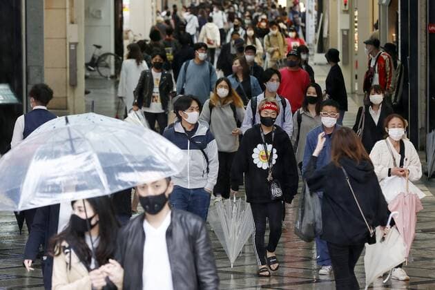 Golden Week holidays amid coronavirus pandemic People wearing face masks walk in Osaka s Minami area on April 29, 2021, the first day of Japan s Golden Week holiday period, as Tokyo as well as Osaka, Kyoto and Hyogo prefectures are under a coronavirus state of emergency due to a resurgence in infections. 