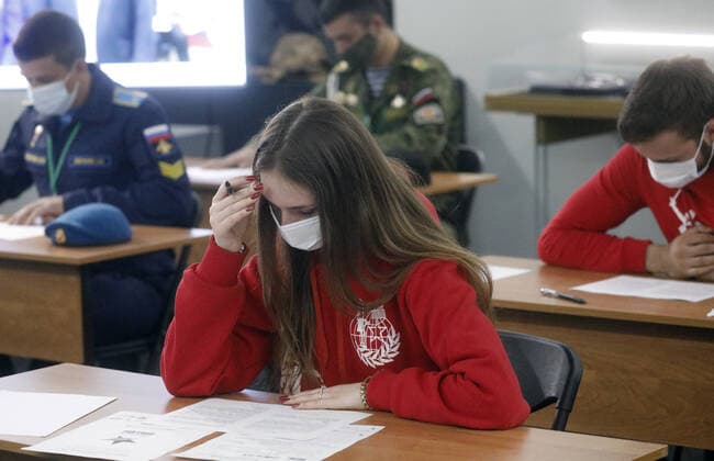 TVER REGION, RUSSIA â€“ APRIL 29, 2021: A girl wearing a face mask takes a history competence test on World War II, Victory Dictation, at the WWII Rzhev Memorial to the Soviet Soldier. Alexander Shcherbak TASS  TS0FE755