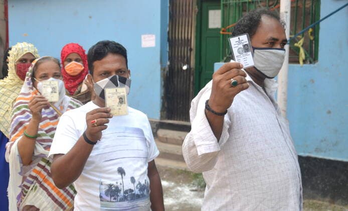India: Last Phase of voting at West Bengal Assembly Election 2021 Showing their s Voter Identity Card before enter the voting booth in North Kolkata. Calcutta West Bengal India Copyright: AnubrataxMondal
