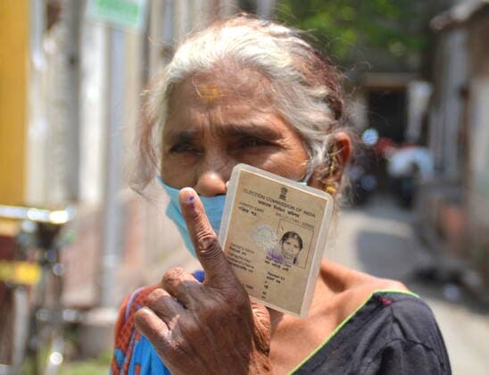 India: Last Phase of voting at West Bengal Assembly Election 2021 A Senior citizen voter is showing marks after casting her vote on West Bengal State Election 2021 during the periods of 2nd wave of Covid19 Epidemic. Calcutta West Bengal India Copyright: AnubrataxMondal