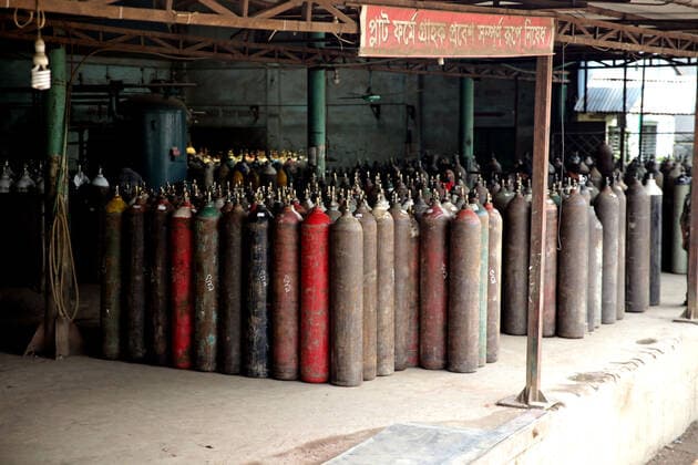 (210429) -- NARAYANGANJ, April 29, 2021 -- Photo taken on April 29, 2021 shows oxygen cylinders ready for shipment at a refilling station in Narayanganj on the outskirts of Bangladesh capital Dhaka. Workers at oxygen refilling stations including the one in Narayanganj are now working overtime to meet the growing demand on hospitals. BANGLADESH-NARAYANGANJ-COVID-19-OXYGEN CYLINDERS Salim 