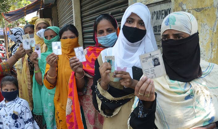 India: Eight phase of West Bengal state elections Voters stand in a queue at a polling station during the eight phase of West Bengal state elections in Kolkata, India. India Copyright: SanjayxPurkait