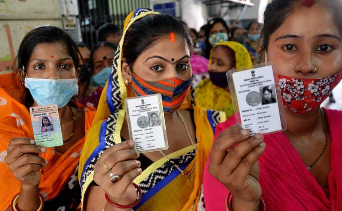 India: Eight phase of West Bengal state elections Voters stand in a queue at a polling station during the eight phase of West Bengal state elections in Kolkata, India. India Copyright: SanjayxPurkait
