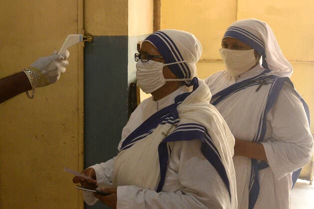 KOLKATA, INDIA - APRIL 29: Nuns of Missionaries of Charity being thermal screened before casting their vote during the eighth phase of West Bengal Assembly Electionss, at St. Mary s School on April 29, 2021 in Kolkata, India. Sealing the fate of West Bengal, the last of the 8-phase state elections is currently underway with 35 seats up for grabs. Results for all 294 seats will be announced on May 2. (Photo by Samir Jana Hindustan Times) Voting For Eight Phase Of West Bengal Assembly Elections
