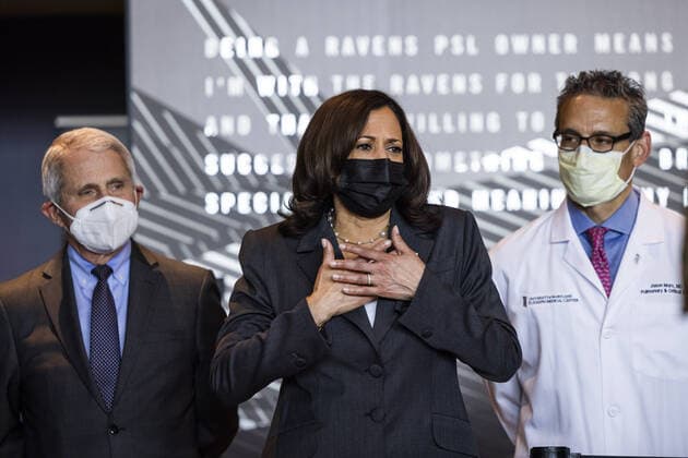 Vice President Kamala Harris (C), alongside Director of the U.S. National Institute of Allergy and Infectious Diseases Anthony Fauci (L) and pulmonologist Dr. Jason Marx (R), visits the M&T Bank Stadium Mass Vaccination SITE on her 100th day in office in Baltimore, Maryland, on Thursday, April 29, 2021.  BAL20210429101 JIMxLOxSCALZO