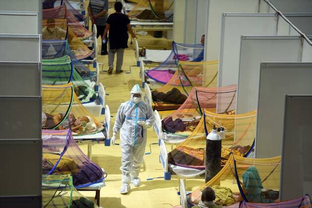 NEW DELHI, INDIA - APRIL 29: Covid-19 patients recuperating at the Covid-19 care centre at the Commonwealth Games (CWG) Village on April 29, 2021 in New Delhi, India. As Covid-19 cases continued to surge in Delhi with over 97,977 active cases people are struggling to get hospital beds, ventilators, oxygen cylinders, injections and medicines with the health infrastructure in the state almost stretched to its limit. (Photo by Raj K Raj Hindustan Times) Temporary Covid Care Facility Centers In Delhi