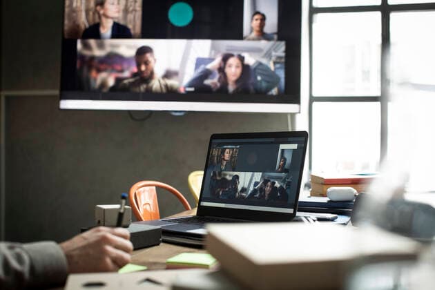 Cropped hand of businessman in meeting with colleagues through video conference at office Sweden, Stockholm, model released, property released Copyright: xMaskotx , MA85855