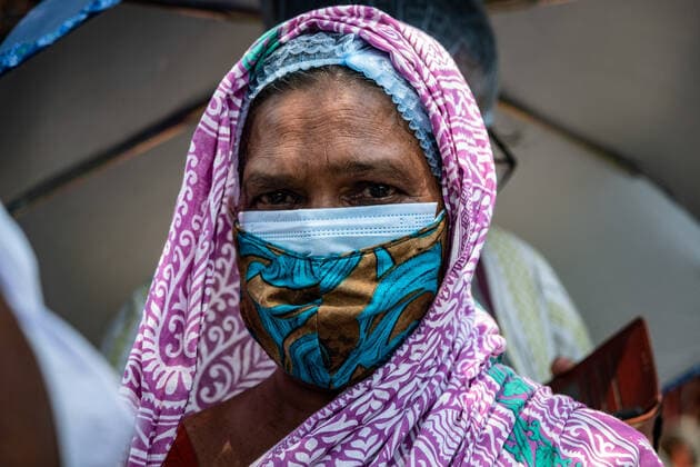 April 30, 2021, Barasat, India: A woman wearing a mask waits in a queue to be vaccinated at the Barasat state General hospital amid the deadly second wave of COVID-19..India is reportedly running out of Covid-19 vaccines just as a virulent second wave continues to devastate the country, threatening the governmentis plans to ramp up the vaccination programme by the weekend in an effort to curb the spread of the virus. Barasat India - ZUMAs197 20210430_zaa_s197_035 Copyright: xDipayanxBosex