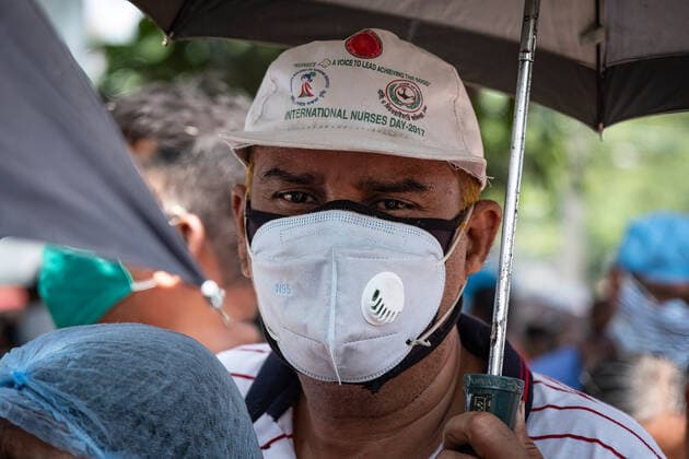 April 30, 2021, Barasat, India: A man wearing a mask waits in a queue to be vaccinated at the Barasat state General hospital amid the deadly second wave of COVID-19..India is reportedly running out of Covid-19 vaccines just as a virulent second wave continues to devastate the country, threatening the governmentis plans to ramp up the vaccination programme by the weekend in an effort to curb the spread of the virus. Barasat India - ZUMAs197 20210430_zaa_s197_037 Copyright: xDipayanxBosex
