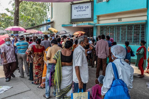April 30, 2021, Barasat, India: People wearing masks wait to be vaccinated at the Barasat state General hospital amid the deadly second wave of COVID-19..India is reportedly running out of Covid-19 vaccines just as a virulent second wave continues to devastate the country, threatening the governmentis plans to ramp up the vaccination programme by the weekend in an effort to curb the spread of the virus. Barasat India - ZUMAs197 20210430_zaa_s197_038 Copyright: xDipayanxBosex