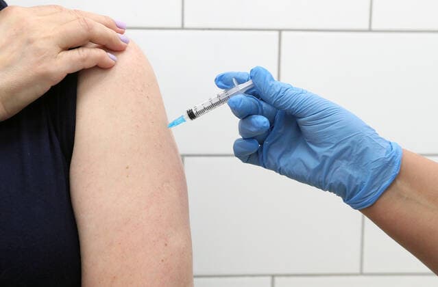 MOSCOW, RUSSIA â€” APRIL 30, 2021: A woman is injected with the Gam-COVID-Vac vaccine (under the brand name of Sputnik V) at a temporary vaccination site in the Globus superstore. A mobile vaccination team is providing vaccines free of charge and without prior sign-up. Since the start of the pandemic, Moscow has confirmed more than 1,092,800 cases of COVID-19. Since the beginning of April, the number of new confirmed cases has been increasing in the Russian capital by more than 1,500 daily. Gavriil Grigorov TASS  TS0FEB23