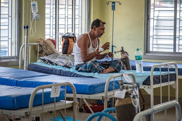 April 30, 2021, Kolkata, India: A covid patient seen sitting on a bed inside a newly made Covid ward at Barasat Government Hospital..India s total coronavirus cases set global records with 18.8 millions cases and 208,000 death as people desperately searching for hospital beds and oxygen cylinders are finding help on social media according to an Indian media report. Kolkata India - ZUMAs197 20210430_zaa_s197_044 Copyright: xDipayanxBosex