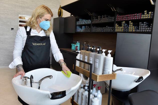 A hairdresser Kristyna Humlova prepares her salon in the Futurum shopping mall in Brno, for reopening as further coronavirus lockdown restrictions are lifted in Czech Republic. Hairdressers, cosmetics, massage, animal care and similar services can reopen in Czechia as of May 3 amid the improving coronavirus epidemic situation. (CTKxPhoto VaclavxSalek) CTKPhotoP2021043007186  sal 02
